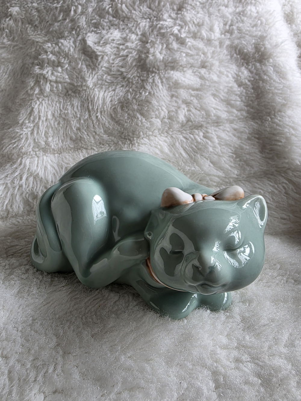 Ceramic Sleeping Cat Figurine in Sage Green with Bow Accent